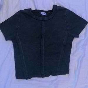 soft black cropped tee with outward seam detailing